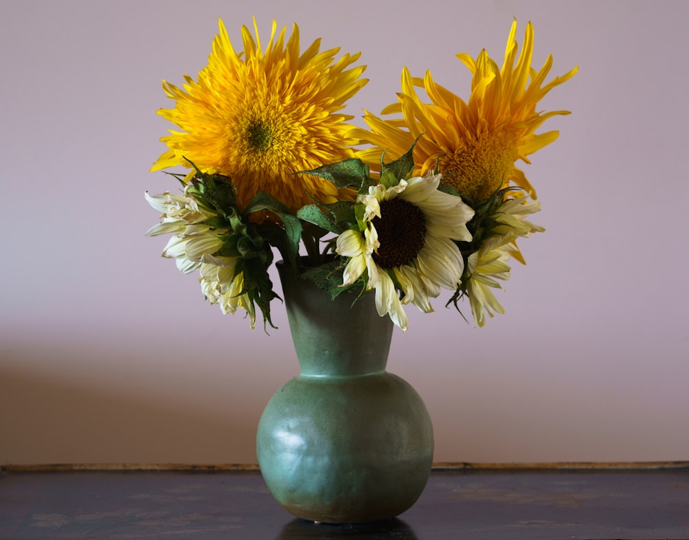 a vase with yellow flowers