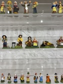 High-end collectible ceramic figurines arranged artistically on a shelf.