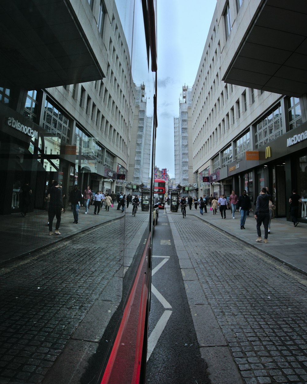 a busy street with people walking
