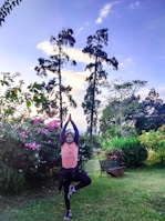 An instructor guiding a small class through fluid, mindful movements in a serene garden setting.
