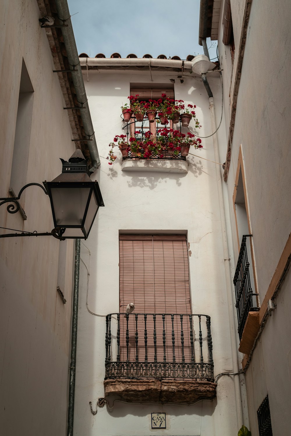 a balcony with flowers on it