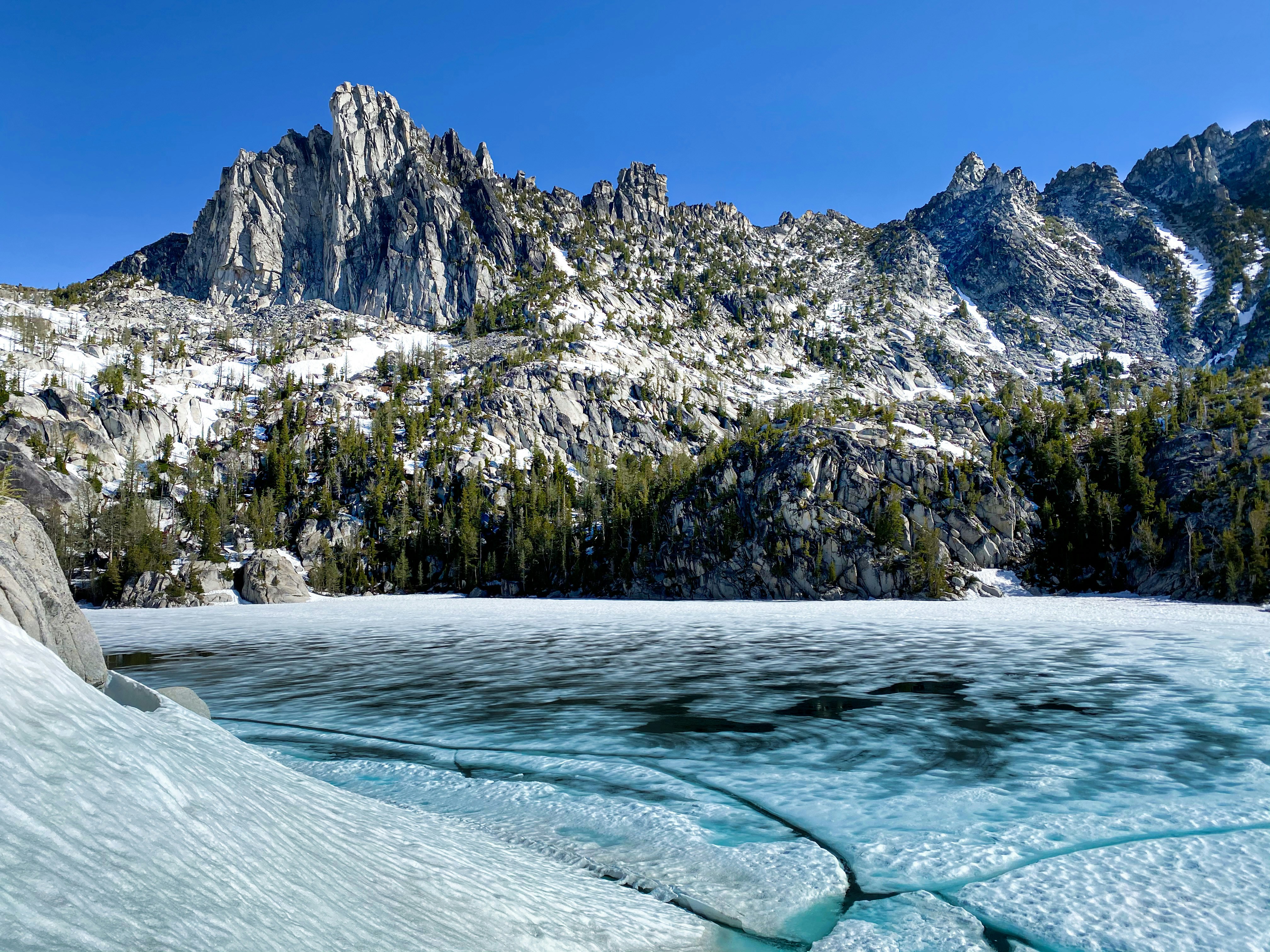 a body of water with a mountain in the background