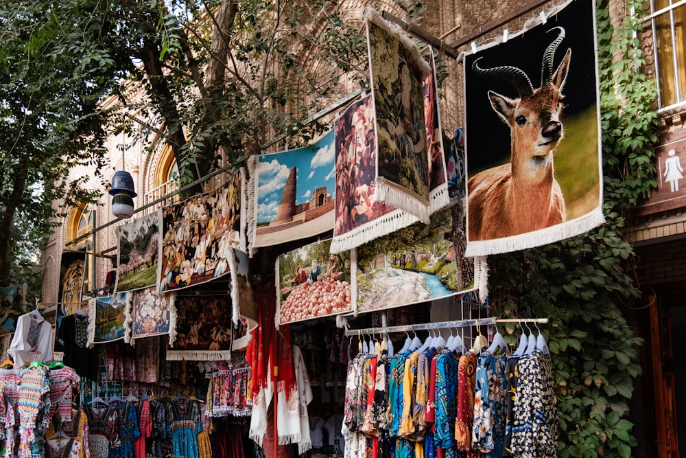 a wall with a painting and clothes on it