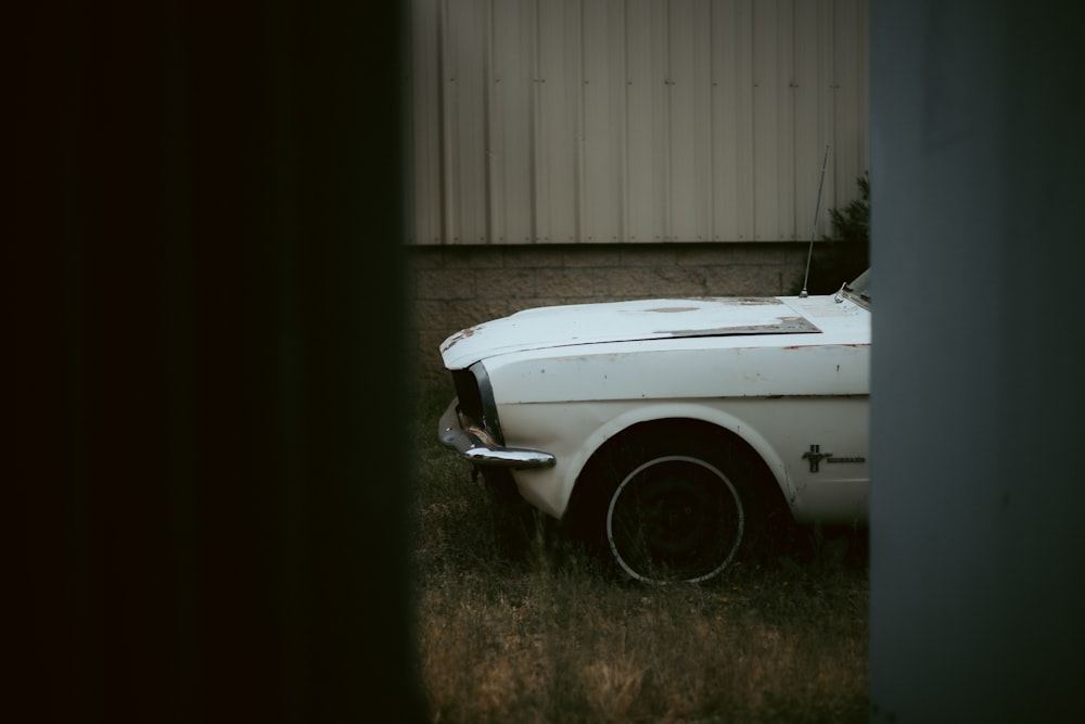 a white car parked in a driveway