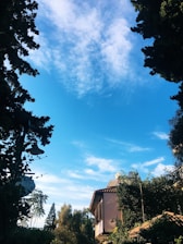 A serene image of a home with clear skies, symbolizing comfort and fresh air.