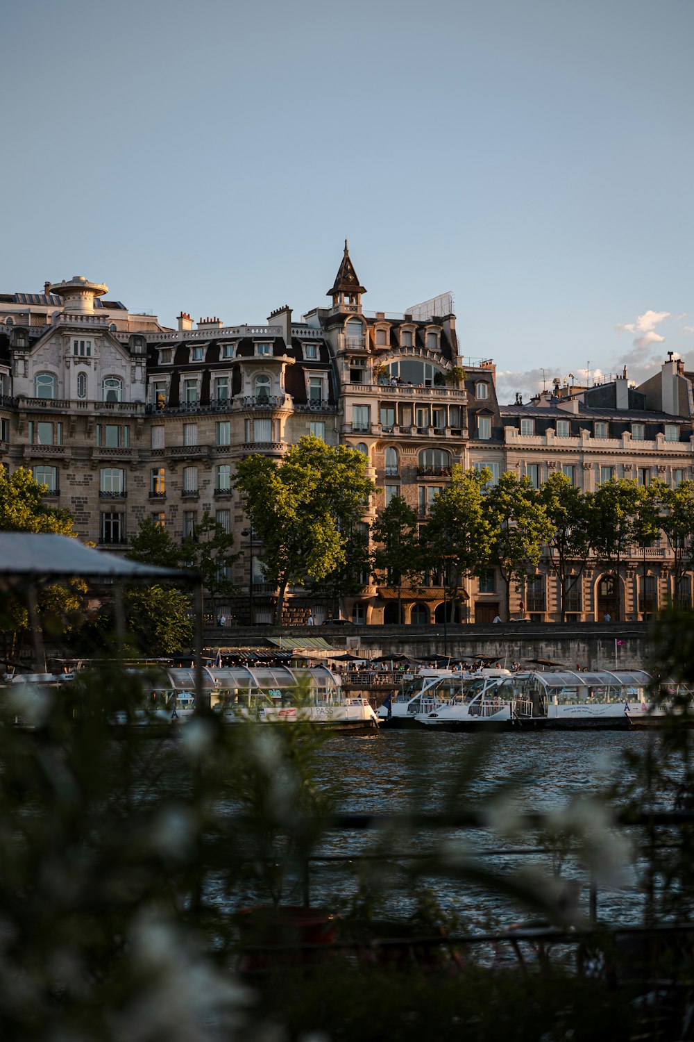 a river with a bridge and buildings along it