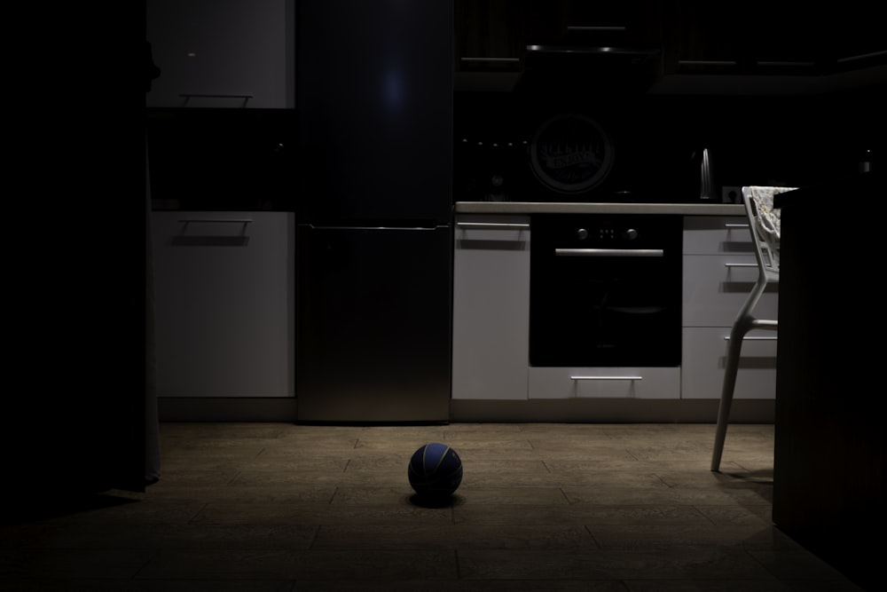 a ball on the floor in a kitchen