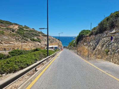 Coastal road with a sign