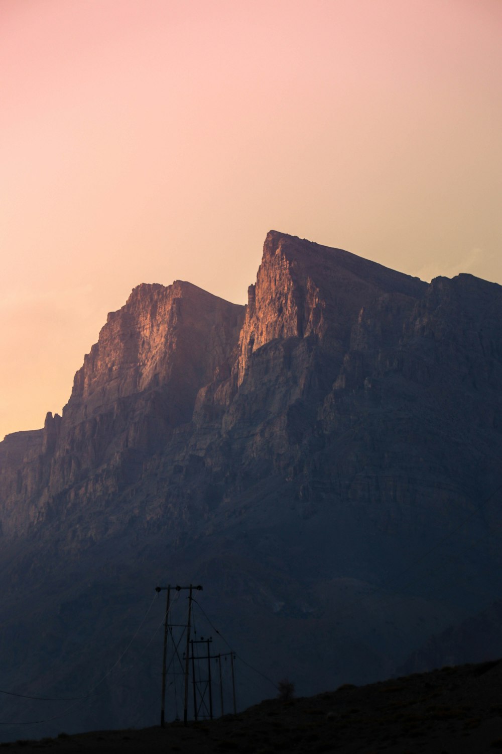 a mountain with a power line