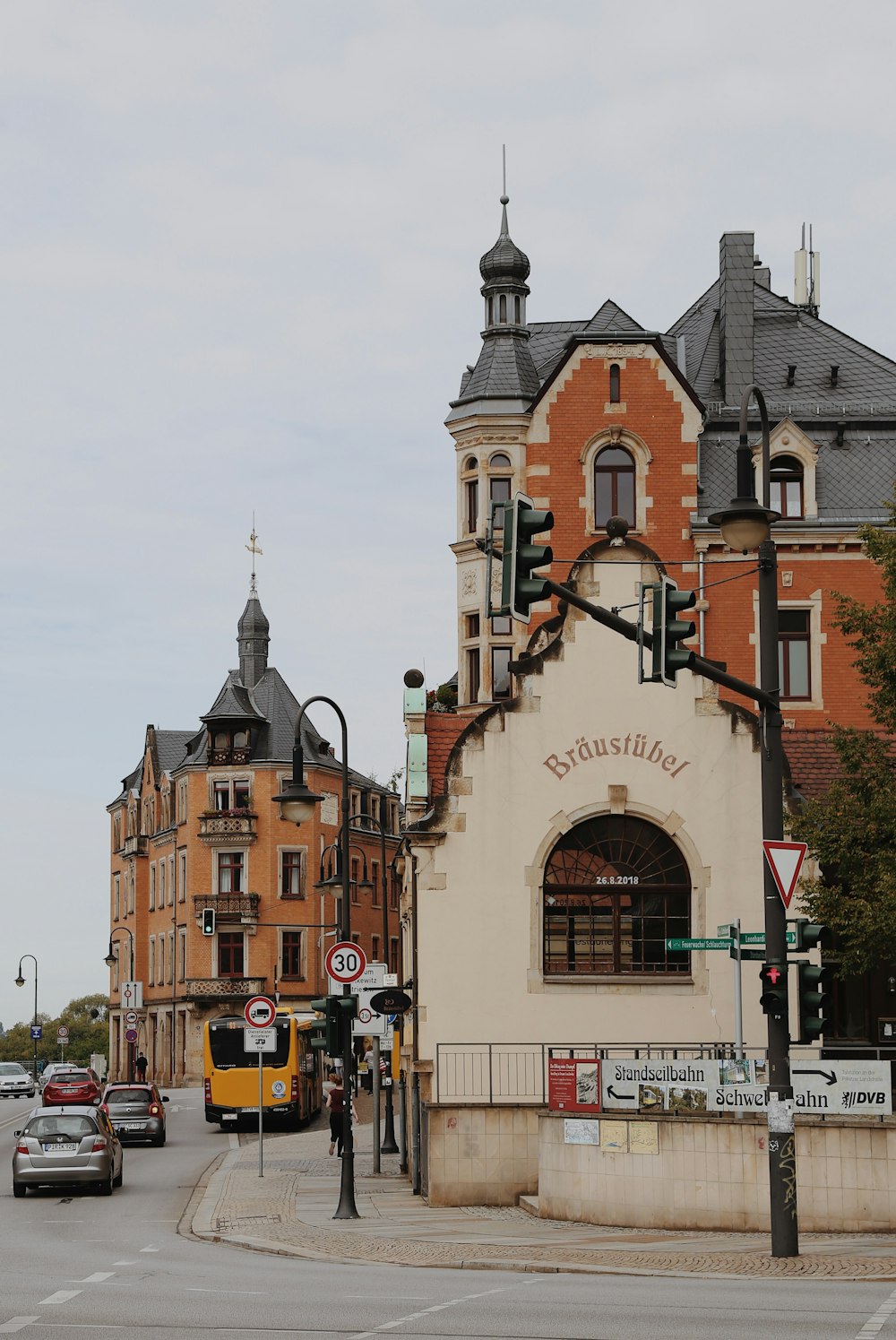 a street with cars and buildings