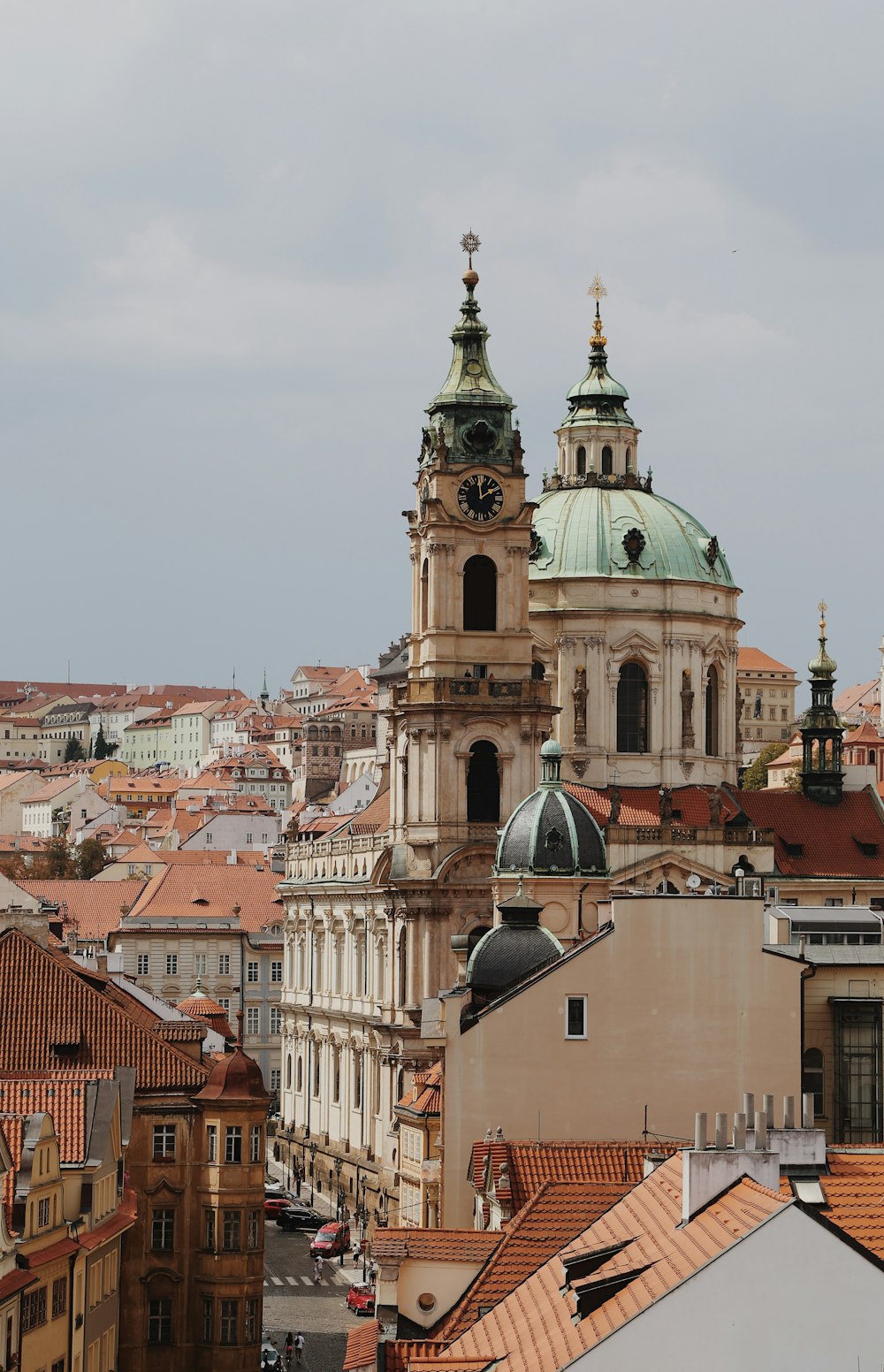 a large building towers over a city