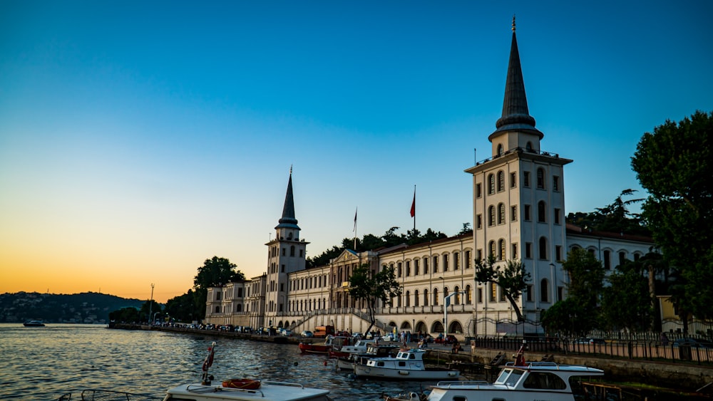 a building with a tower by the water