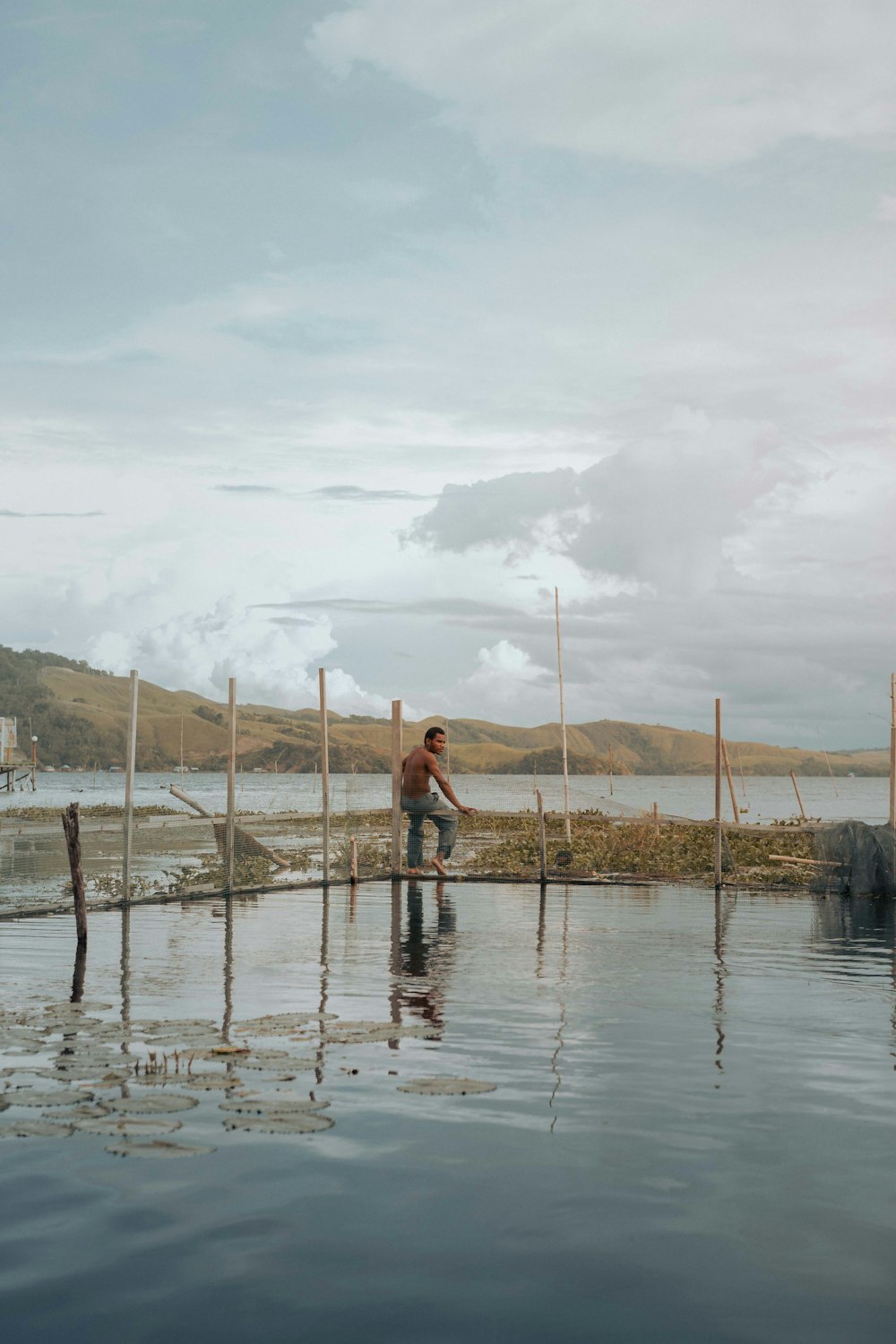 a man standing in a body of water