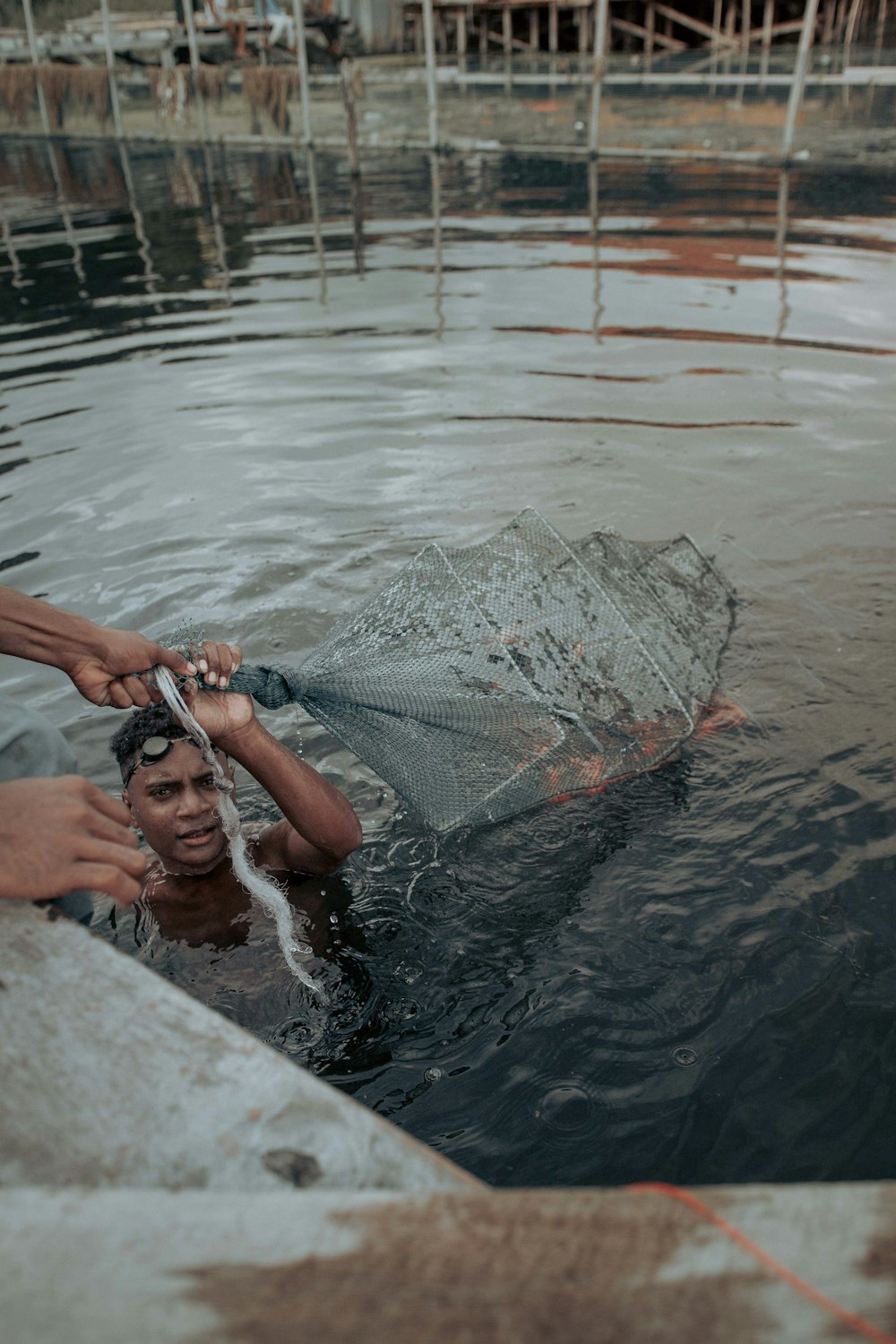 a man in a muddy pool