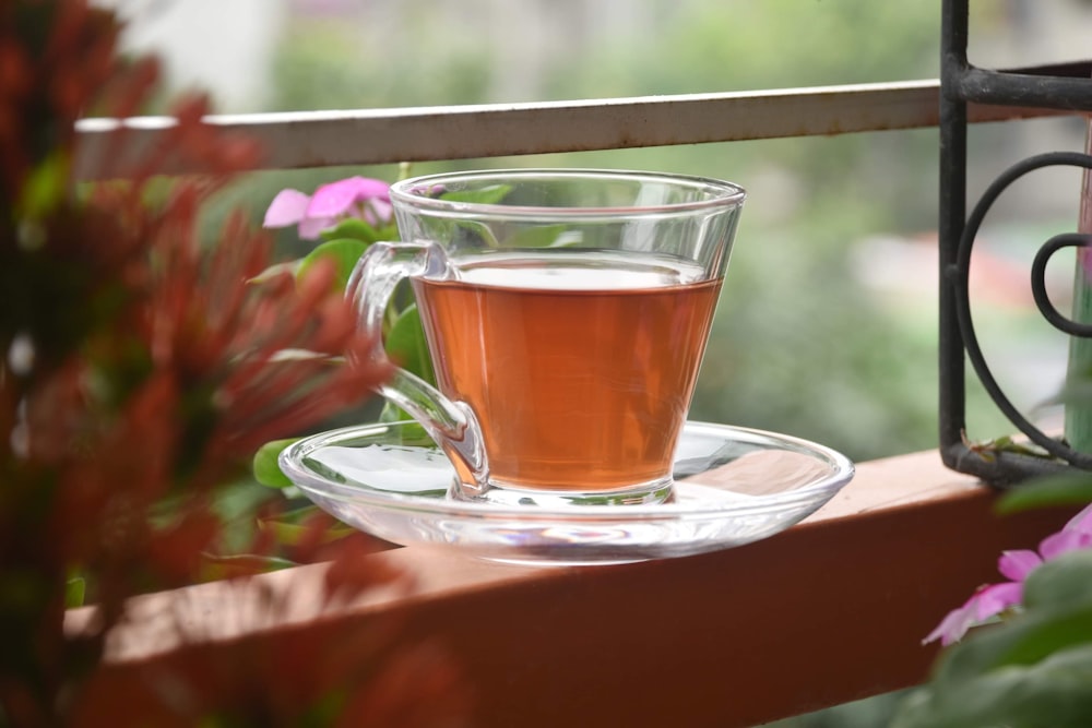 a glass of tea on a saucer