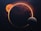 An astronomical scene featuring a large planet with swirled, colorful patterns, partially illuminated by a radiant orange sun positioned behind it. A smaller moon-like body is situated in the foreground, casting a shadowed surface. The background is a starry space with hints of nebulous clouds.