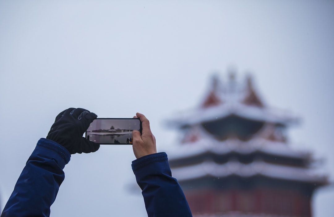 Traveler using smartphone for navigation and translation in China