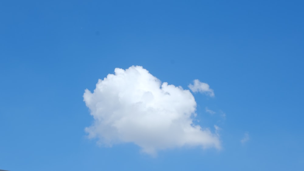 a blue sky with a cloud