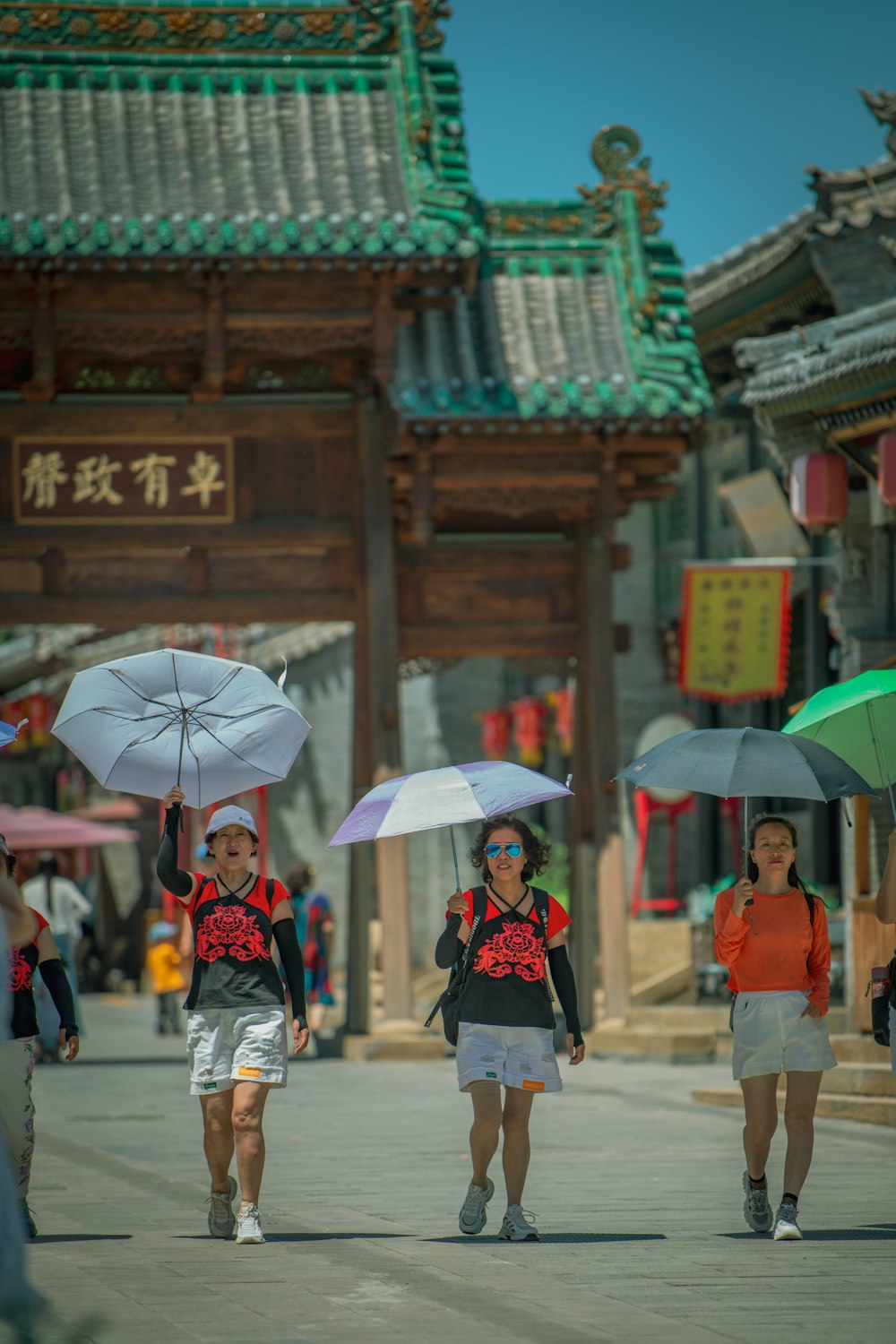 people walking with umbrellas