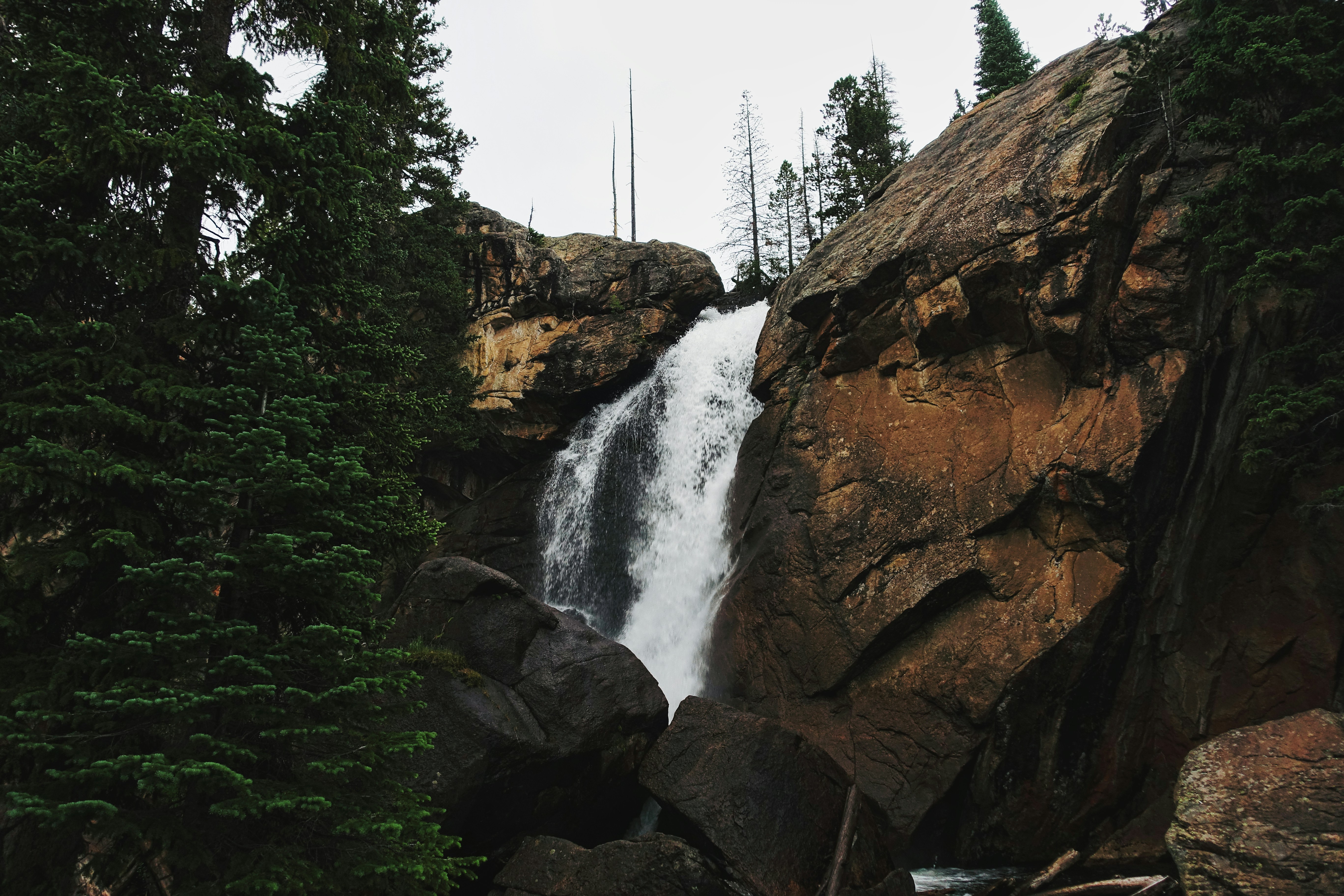 a waterfall over a rocky cliff