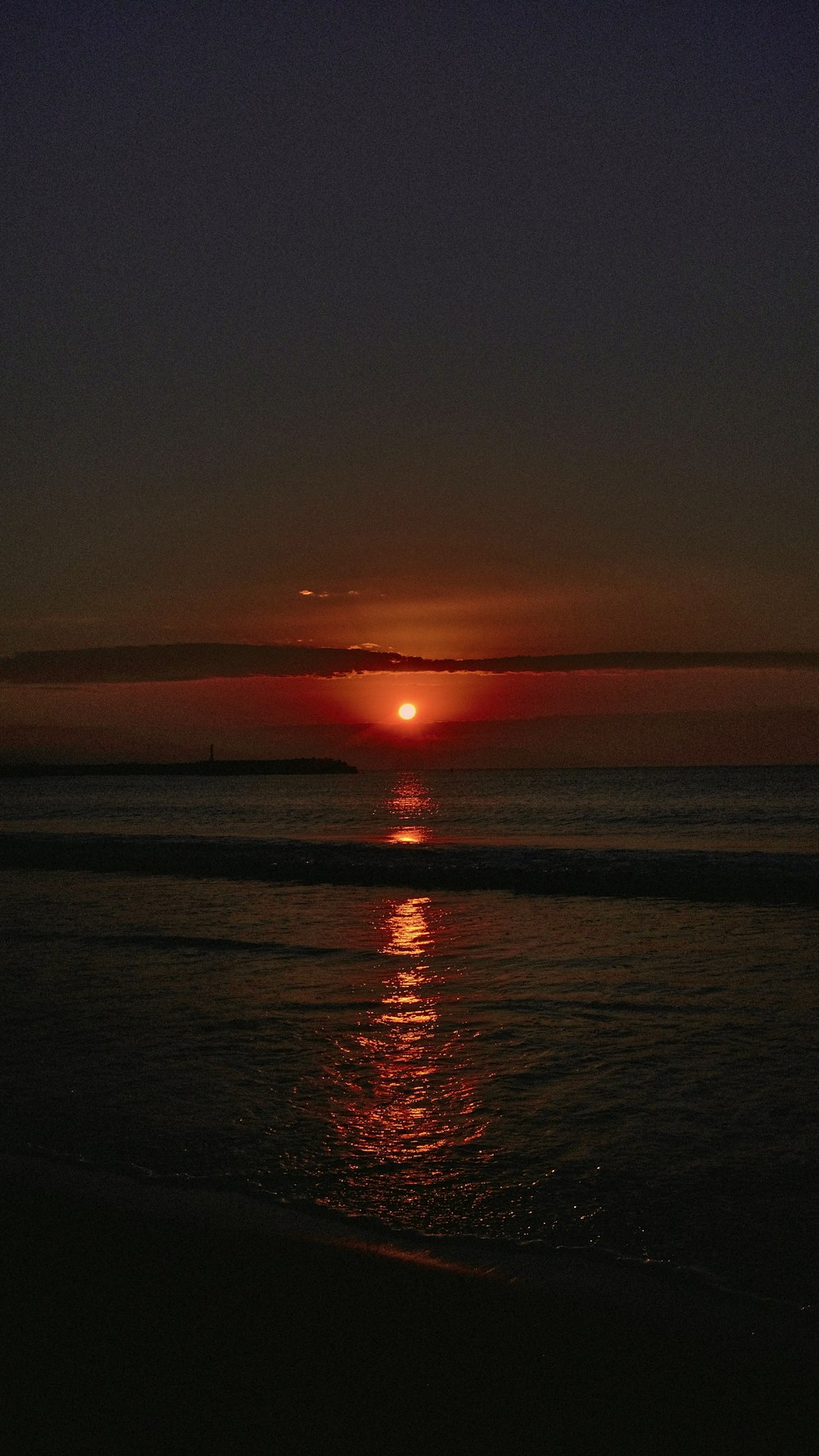 a sunset over a body of water