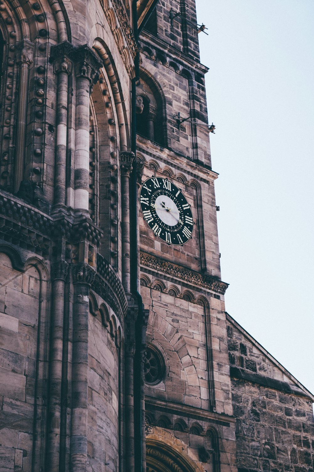 a large clock on a stone building