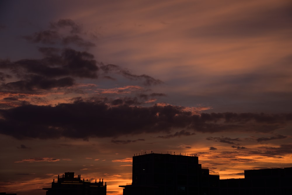 a sunset over buildings