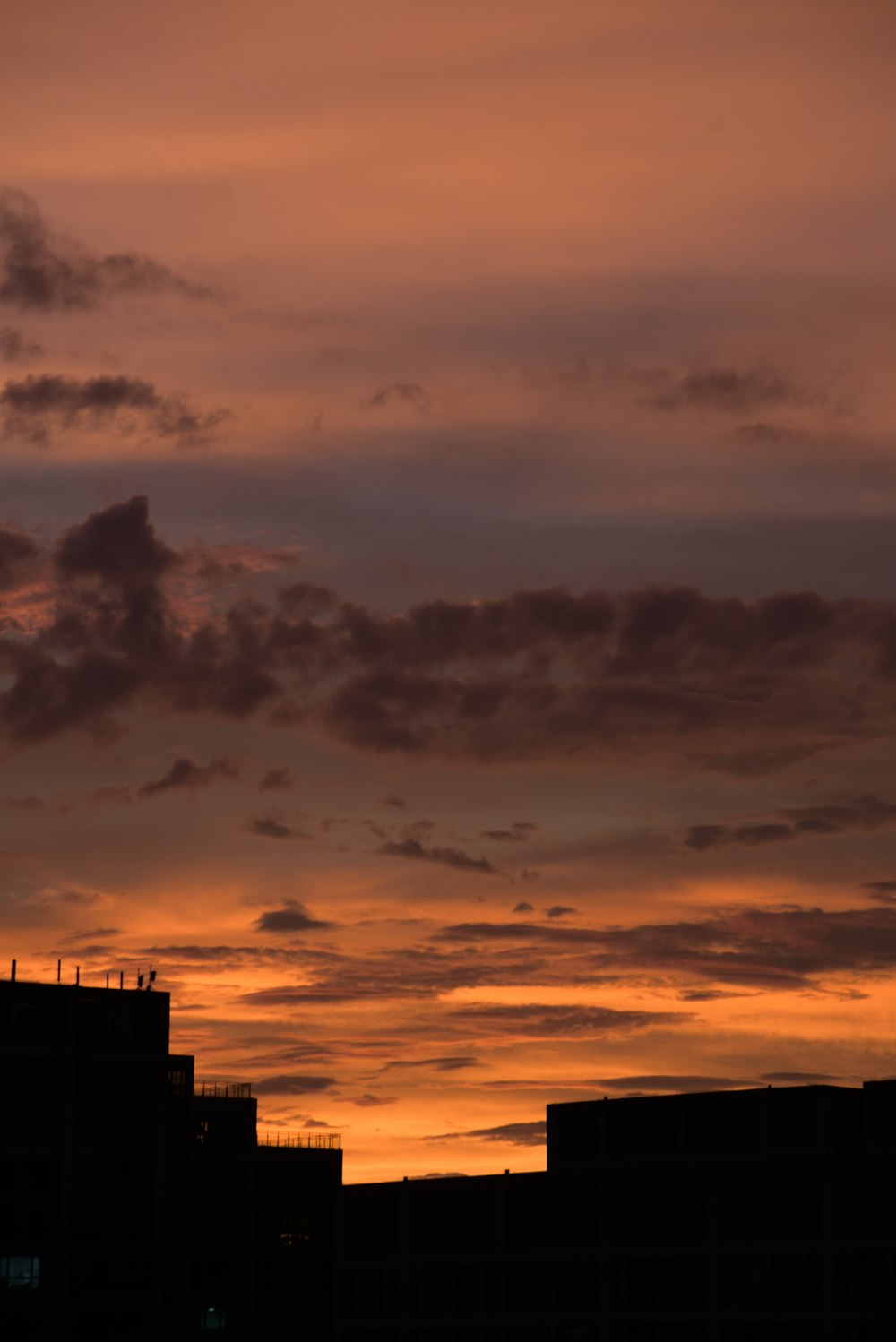 a sunset over buildings