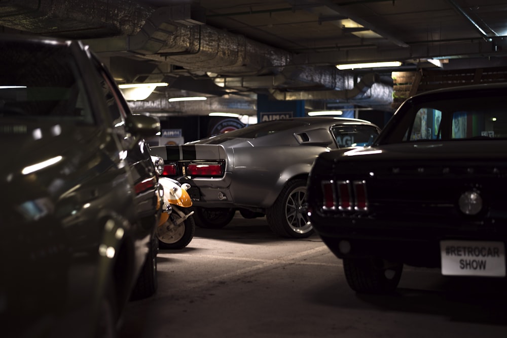 a group of cars parked in a parking garage