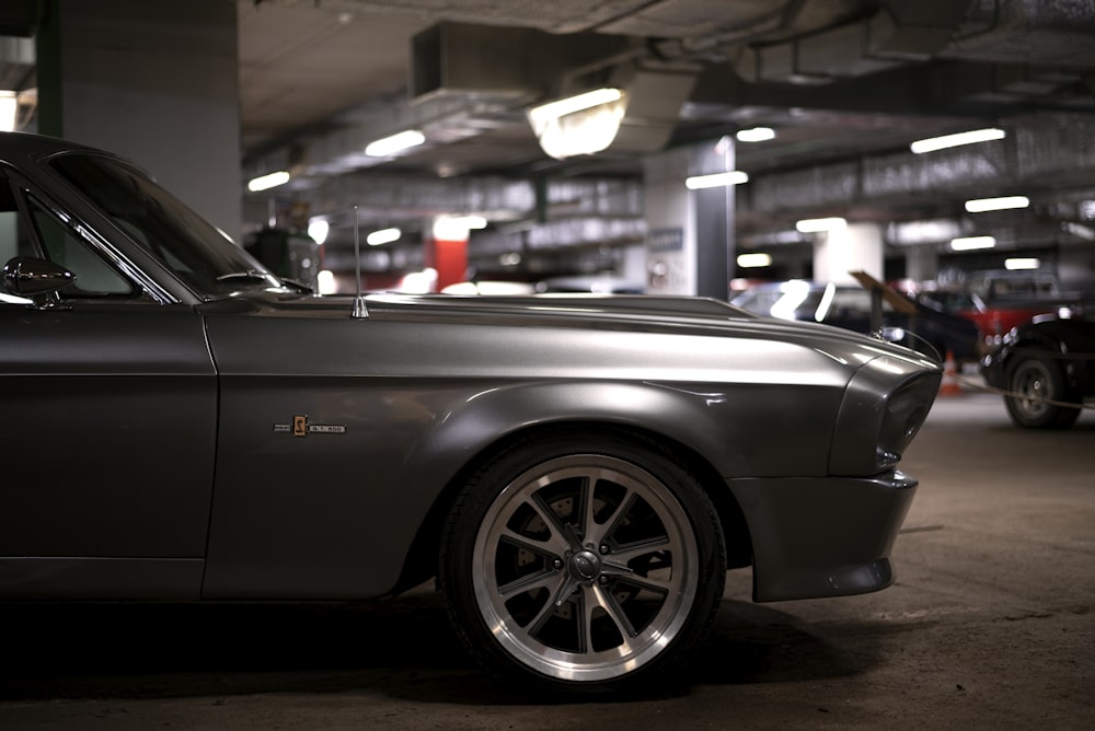 a black car parked in a parking garage