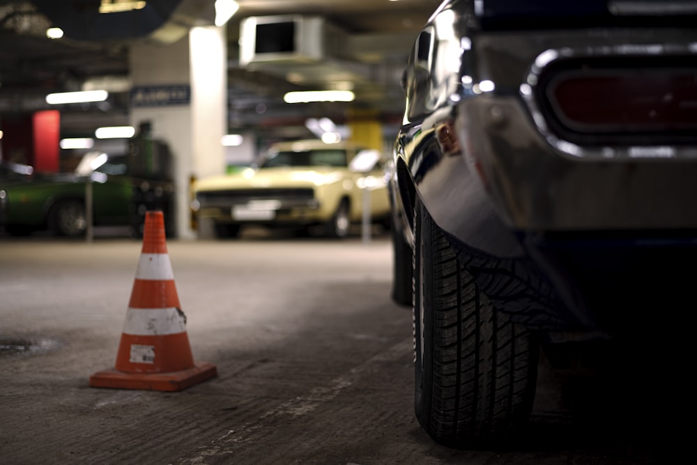 a traffic cone next to a car