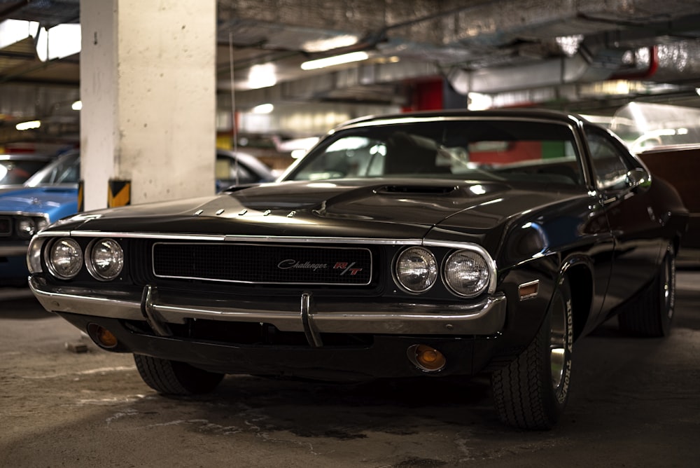 a black car parked in a parking garage