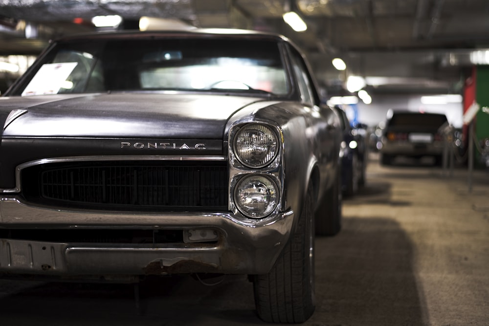 a black car parked in a parking garage