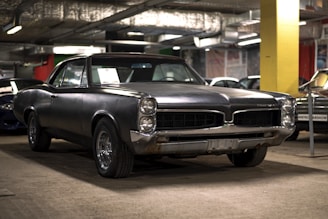 a black car parked in a garage
