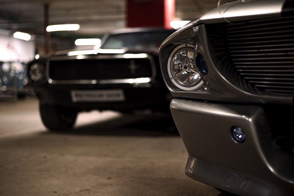 a couple of cars parked in a parking garage