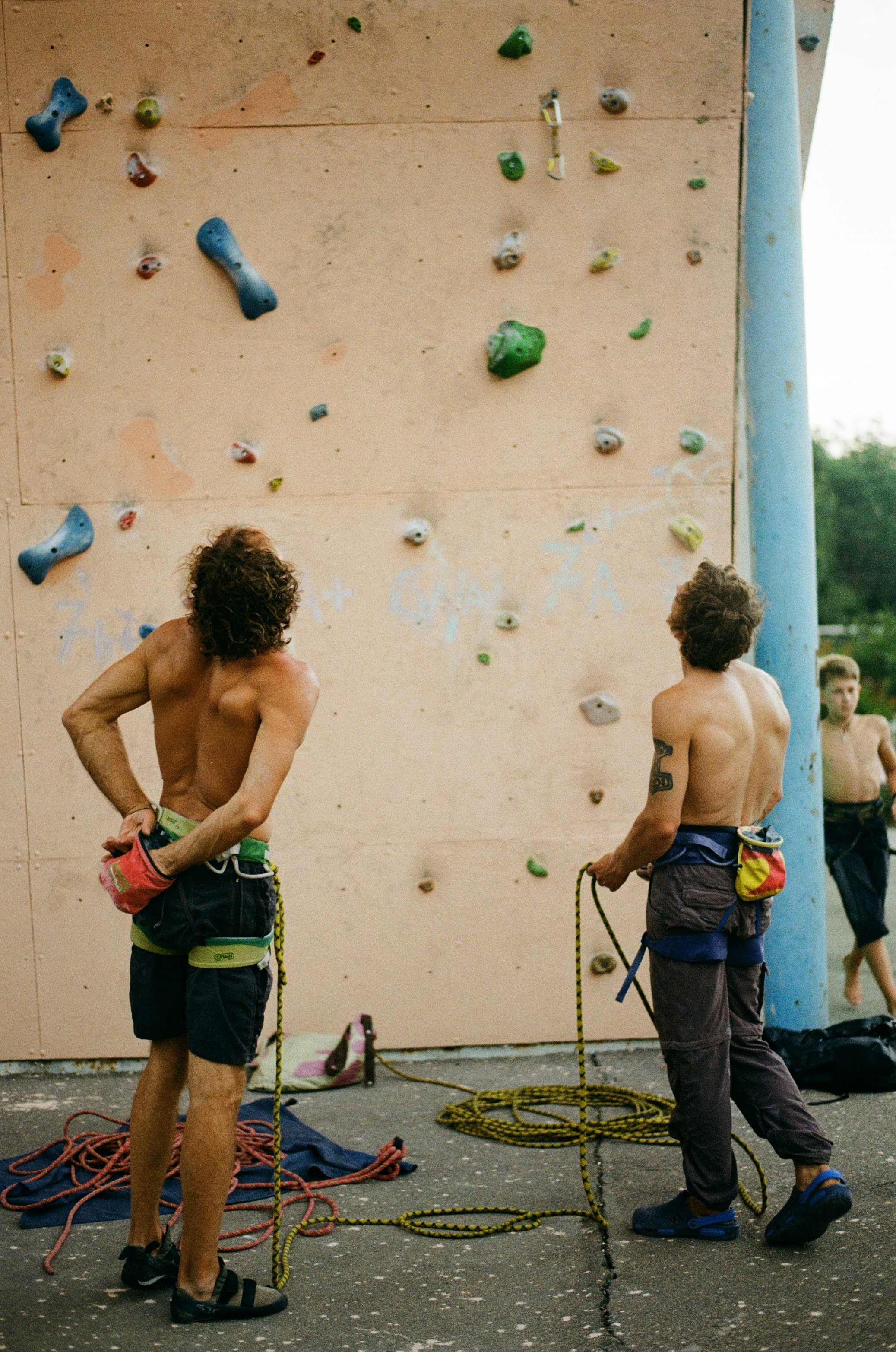 A climber working a bouldering problem