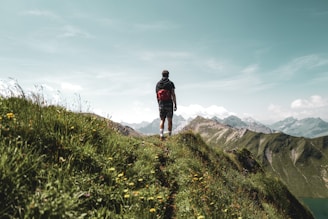 a man walking on a mountain