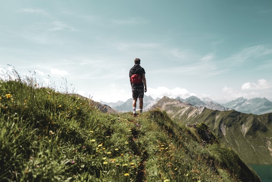 a man walking on a mountain