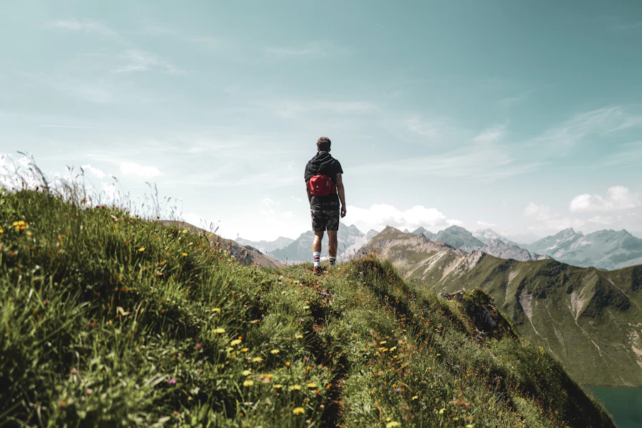 Mature backpacked hiker traversing high alpine terrain.