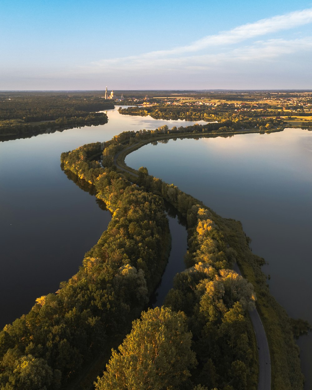 a body of water surrounded by trees