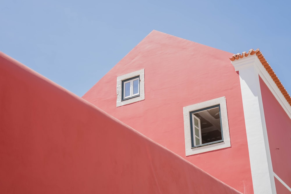 a pink house with windows