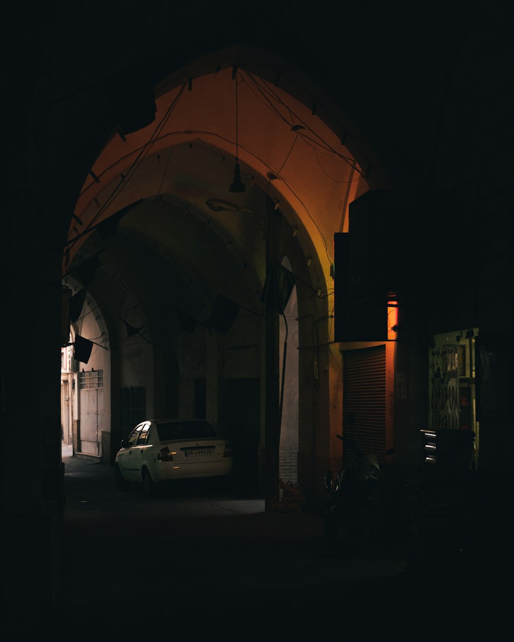 a car parked in a dark room