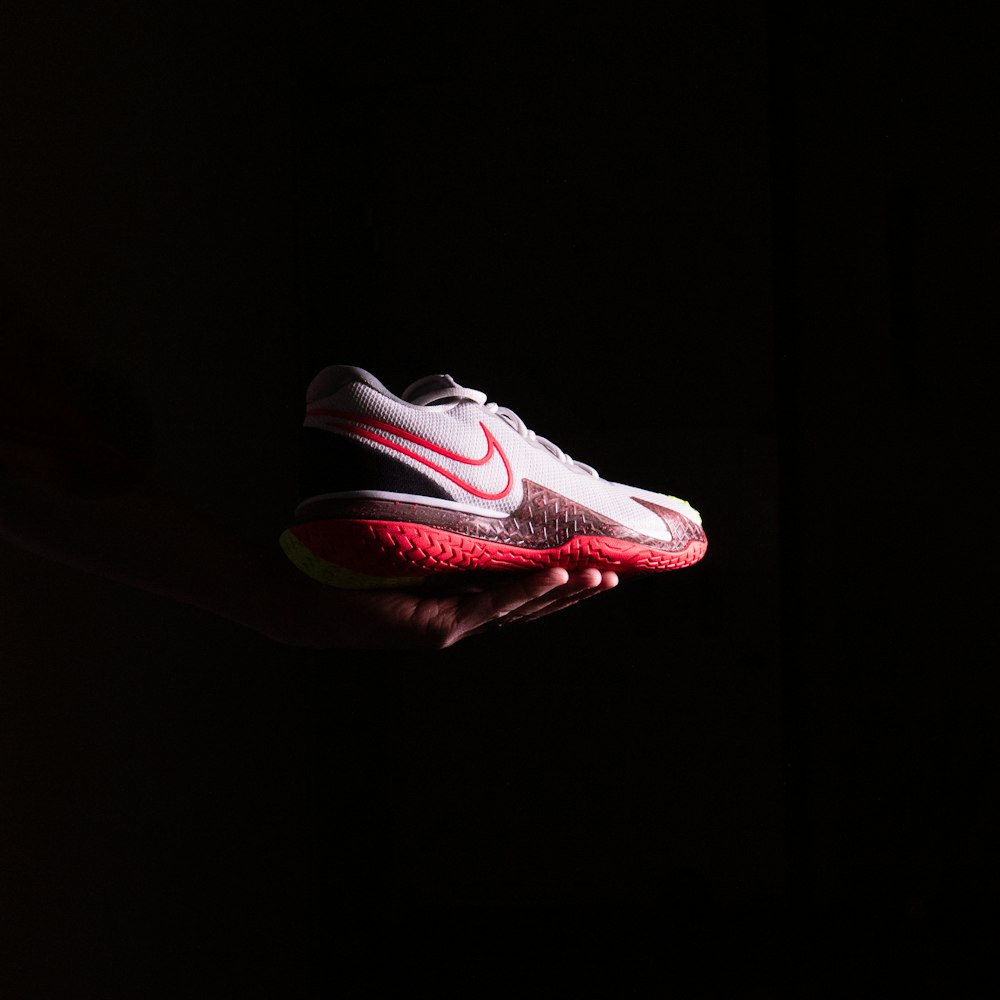 a red shoe on a black background