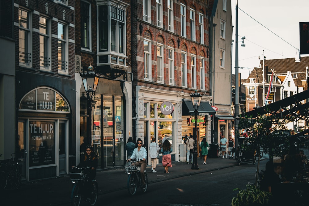 people riding bikes on a street