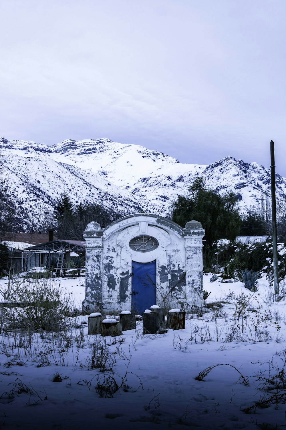 a stone structure in the snow