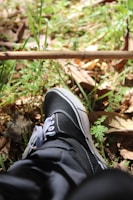 Close-up of a sleek running sneaker on a sunlit trail.