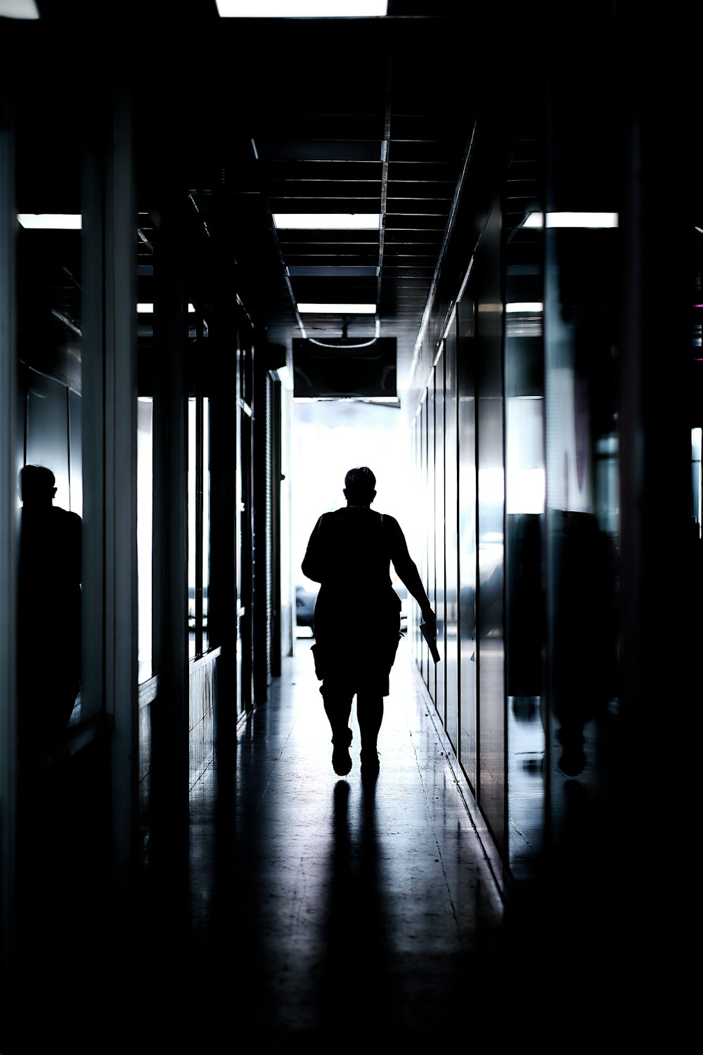 a man walking in a hallway