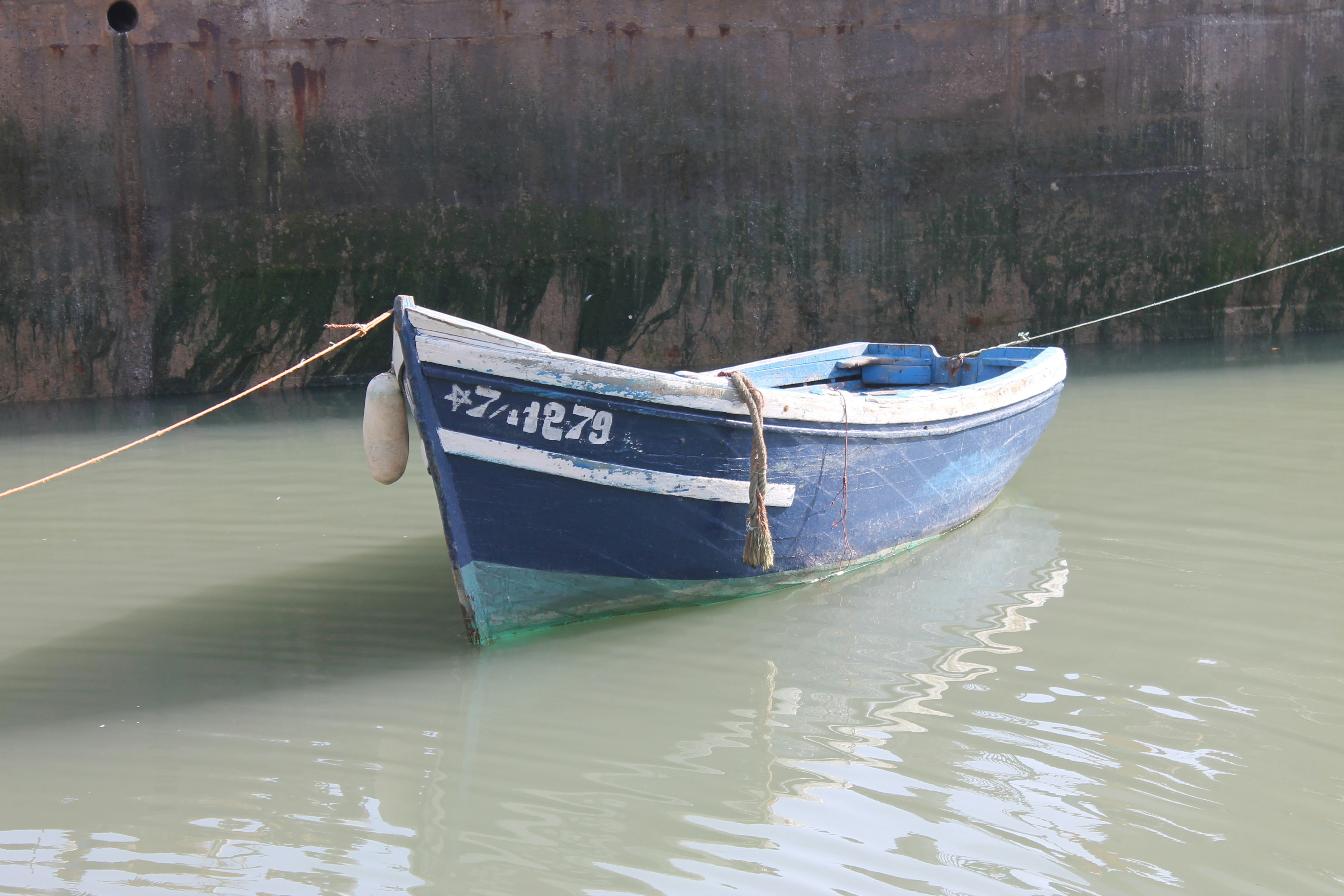 a boat tied to a dock