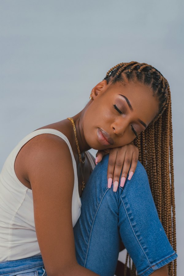Woman with long natural hair, eyes closed