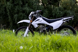 a motorcycle parked in a grassy area